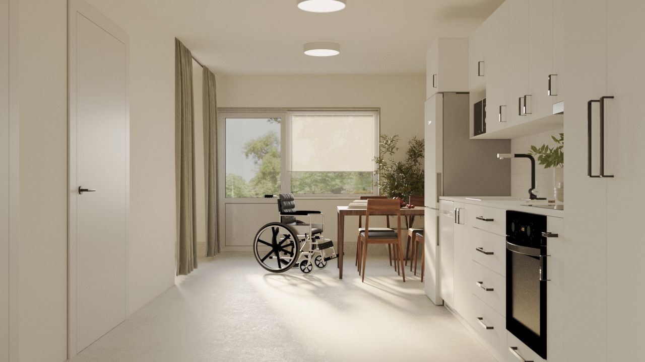 Kök och matsal i LSS Nocken med rullstol vid matbordet.