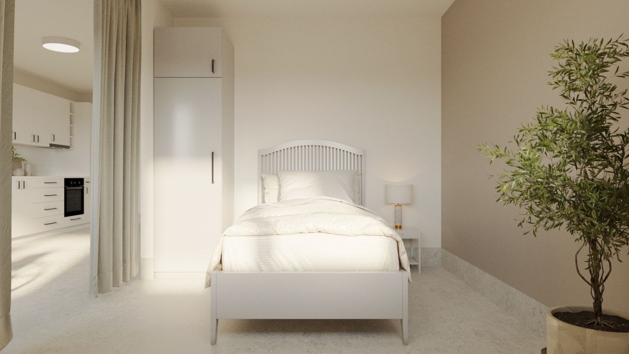 Sovrum i LSS Nocken med enkelbädd, nattduksbord och grön växt.