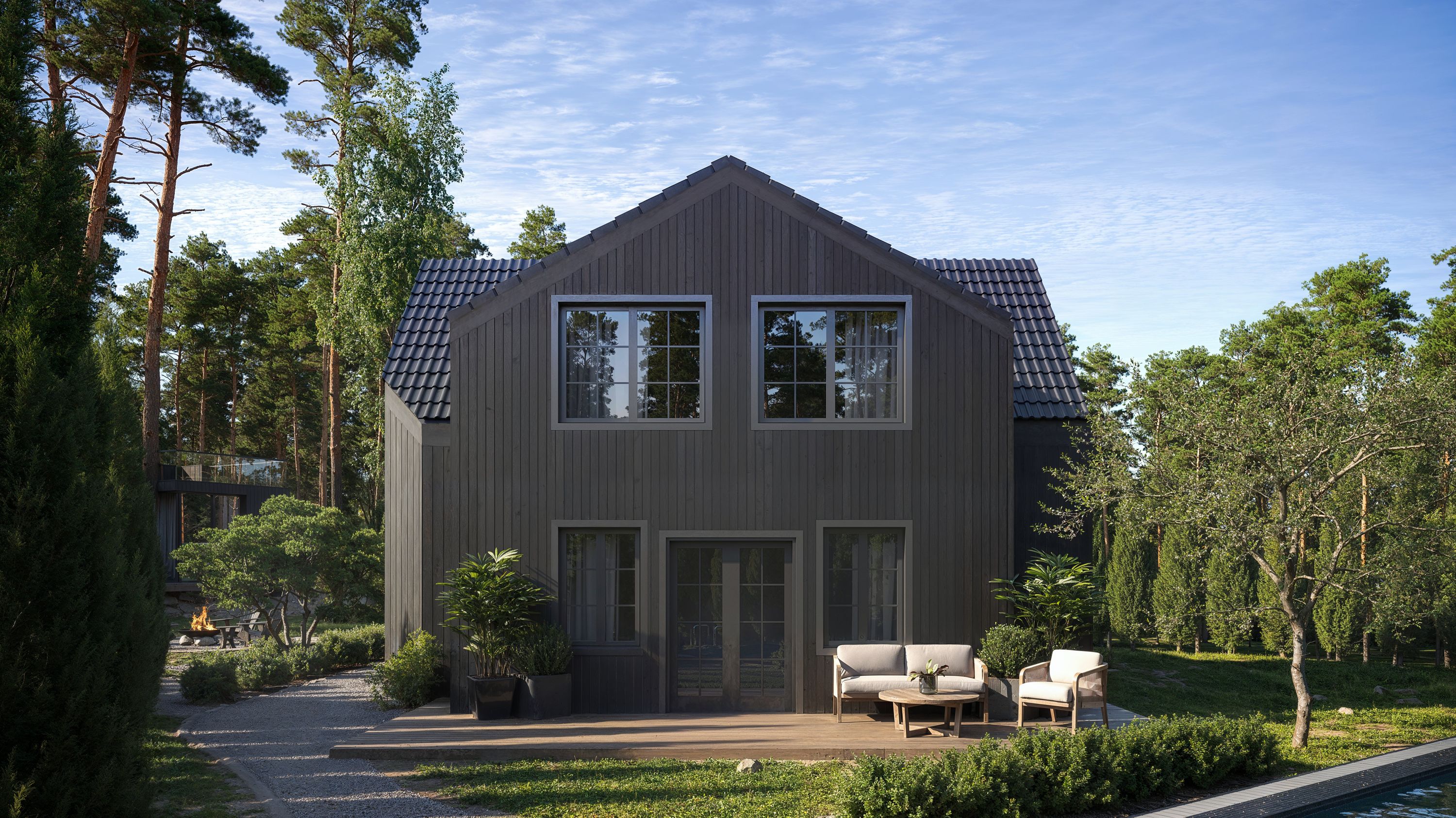 Fotorealistisk rendering av Villa Cosmos – modern villa med träfasad, stora fönster och uteplats i grönskande miljö.