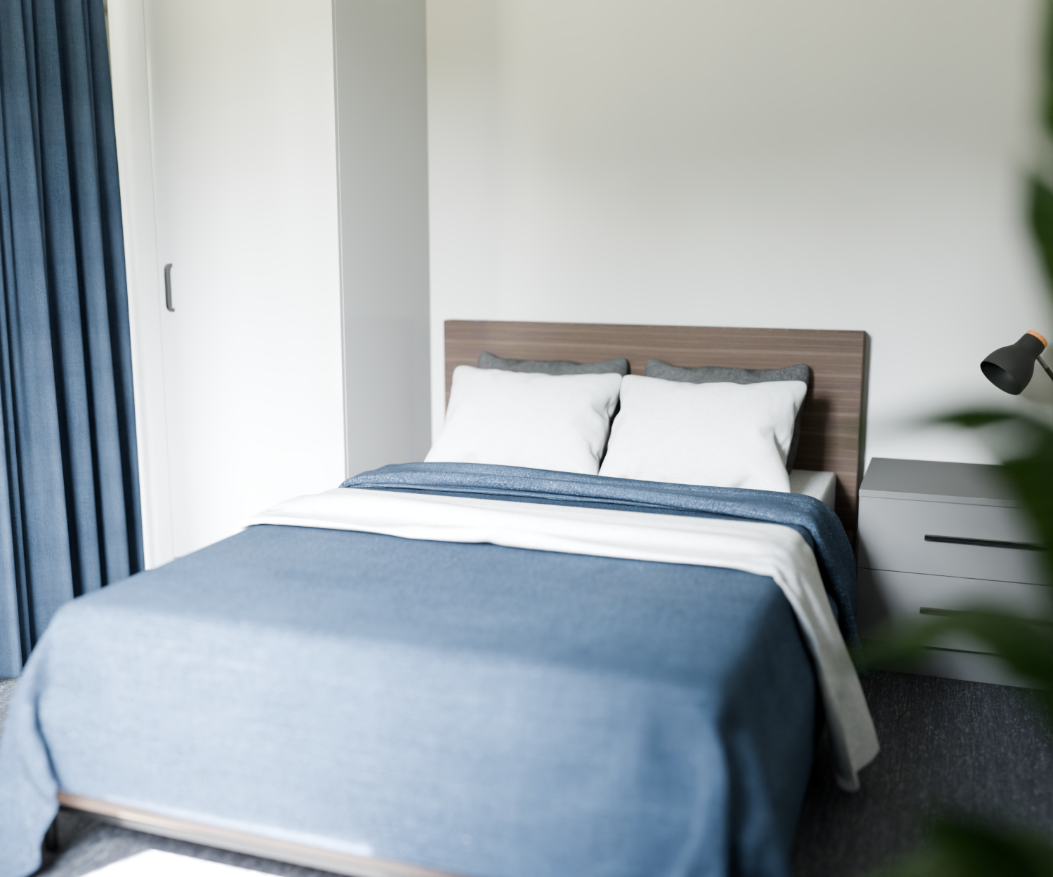 Sovrum i LSS Tureberg med blå sängkläder och ljusa väggar.
